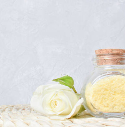Fragrance sea salt with rose flower essential oil. spa treatments. copy space