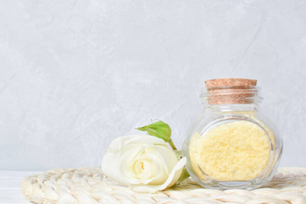 Fragrance sea salt with rose flower essential oil. spa treatments. copy space